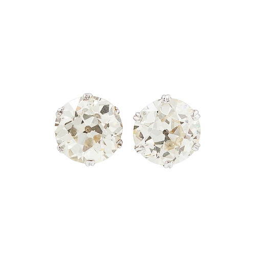 352 - A PAIR OF ANTIQUE DIAMOND STUD EARRINGS, the old cut diamonds mounted in platinum. Estimated: weight... 