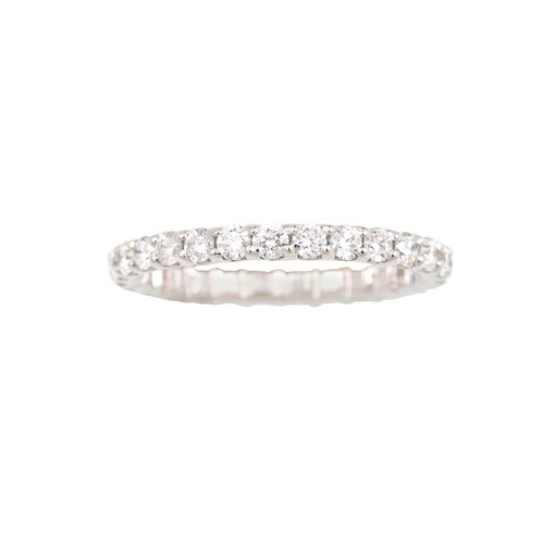 387 - A DIAMOND ETERNITY RING, the brilliant cut diamonds mounted in 18ct white gold. Estimated: weight of... 