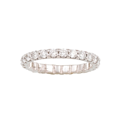 389 - A DIAMOND ETERNITY RING, the brilliant cut diamonds mounted in 18ct white gold. Estimated: weight of... 