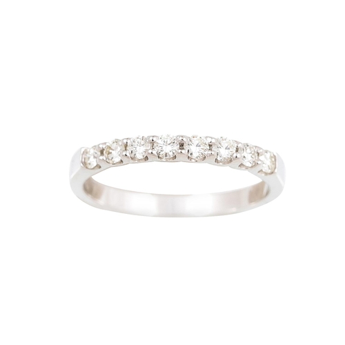 391 - A DIAMOND HALF ETERNITY RING, the brilliant cut diamonds mounted in 18ct white gold. Estimated: weig... 