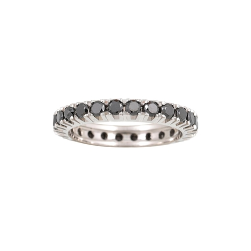 393 - A DIAMOND ETERNITY RING, the black diamonds mounted in 18ct white gold. Estimated: weight of diamond... 