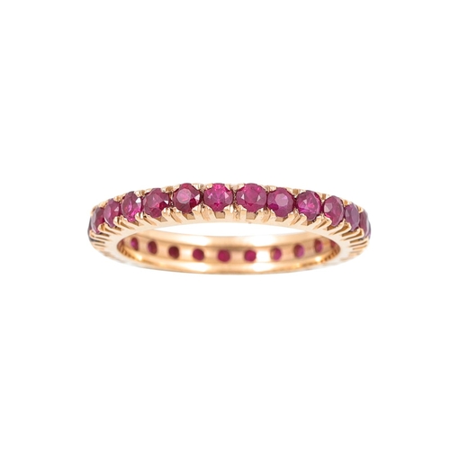 396 - A RUBY ETERNITY RING, the circular stones mounted in 18ct white gold. Estimated: weight of rubies: 2... 