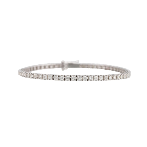 398 - A DIAMOND LINE BRACELET, the brilliant cut diamonds mounted in 18ct white gold. Estimated: weight of... 