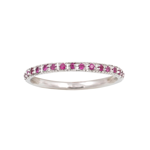 404 - A RUBY ETERNITY RING, the circular stones mounted in 18ct white gold. Estimated: weight of rubies: 0... 