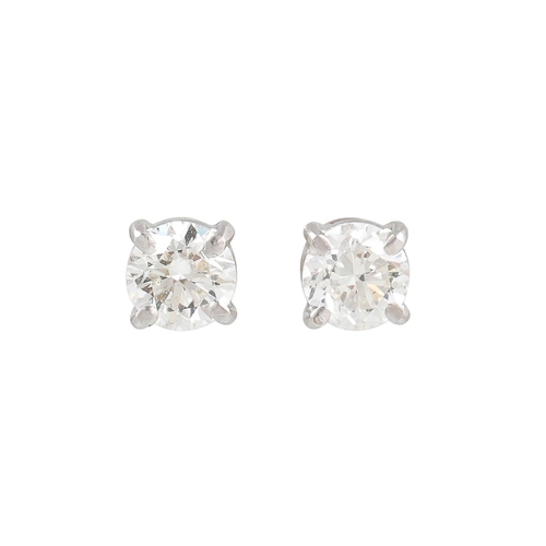 437 - A PAIR OF DIAMOND STUD EARRINGS, the brilliant cut diamonds mounted in 18ct white gold. Weight of di... 