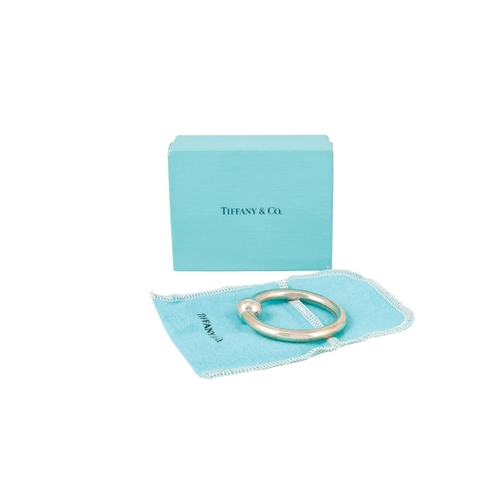 512 - A MODERN STERLING SILVER (.925) TIFFANY & CO. CIRCULAR BABY'S RATTLE, with pouch and box