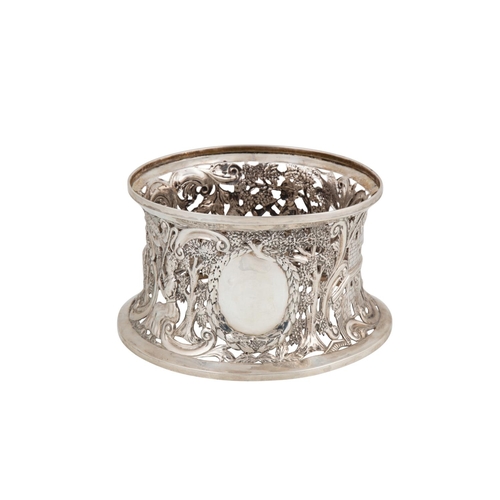 532 - A MODERN IRISH SILVER GEORGIAN STYLE CIRCULAR DISH RING, of waisted form in the Rococo manner, open ... 