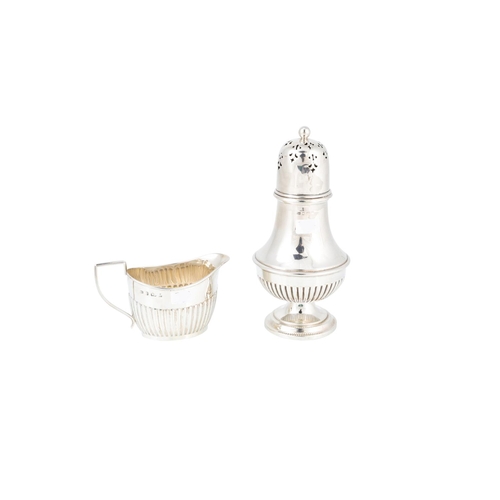 535 - AN EARLY 20TH CENTURY ENGLISH SILVER SUGAR SHAKER, baluster form with gadrooned decoration and a mat... 