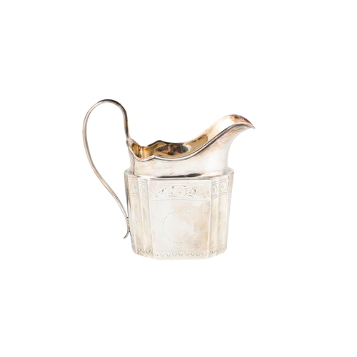 553 - A GEORGE III IRISH SILVER CREAM JUG, bright cut decoration faceted sides, marks rubbed, ca 1800