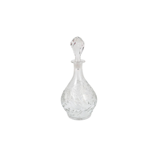 556 - A MID 20TH CENTURY CUT CRYSTAL GLASS DECANTER AND STOPPER, ca 14'' high.