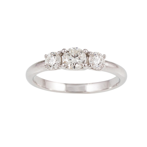 59 - A THREE STONE DIAMOND RING, the brilliant cut diamonds, mounted in 18ct white gold. Estimated: weigh... 