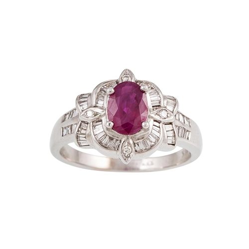 60 - A DIAMOND AND RUBY CLUSTER RING, the oval ruby to a baguette cut diamond surround, mounted in 18ct w... 