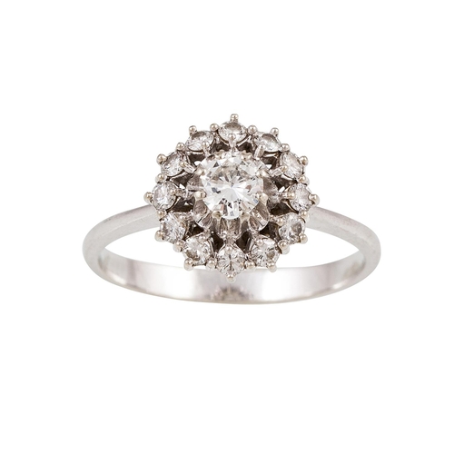 62 - A DIAMOND CLUSTER RING, the brilliant cut diamonds mounted in 18ct white gold. Estimated: weight of ... 