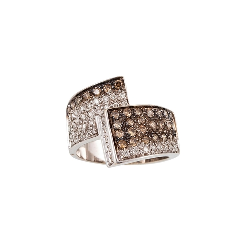 67 - A DIAMOND DRESS RING, of cross over design, pavé set with white and brown diamonds, mounted in 18ct ... 