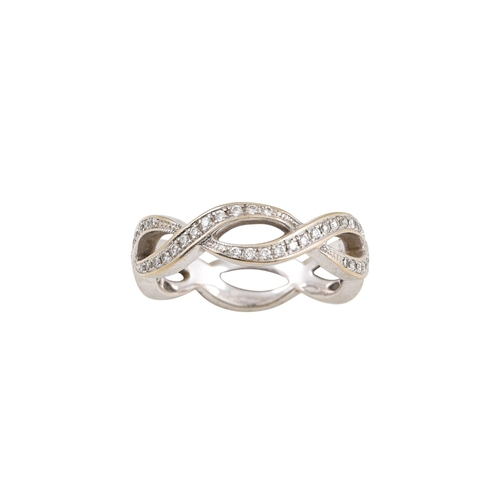 76 - A FULL BANDED DIAMOND ETERNITY RING, cross over design, mounted in 18ct gold, size H-I