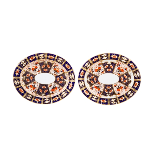 582 - A PAIR OF LATE 19TH CENTURY ENGLISH PORCELAIN OVAL SERVING CHARGERS, hand painted decoration in the ... 