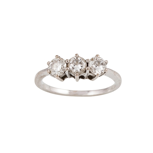 450 - A THREE STONE DIAMOND RING, the brilliant cut diamonds mounted in white gold. Estimated: weight of d... 