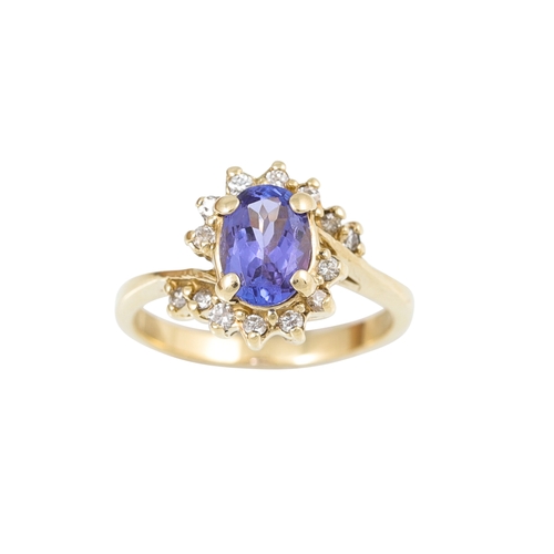 470 - A TANZANITE AND DIAMOND CLUSTER RING, mounted in 14ct gold. Size L - M