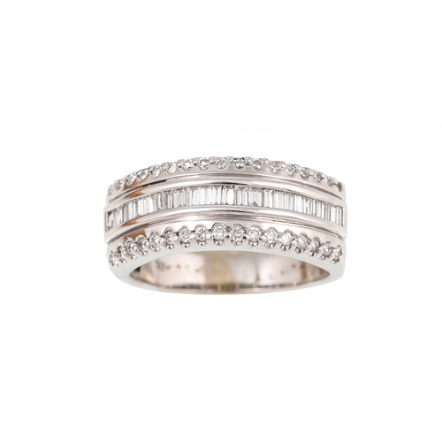 473 - A DIAMOND SET HALF ETERNITY RING, mounted in 18ct gold. Size K - L