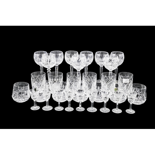 561 - NINE WATERFORD CRYSTAL LIQUEUR GLASSES, together with nine wine glasses, seven brandy glasses and fi... 