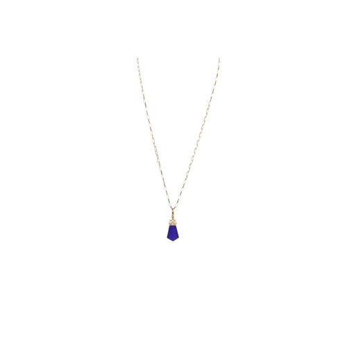 105 - A LAPIS LAZULI AND ONYX FOB, on a 9ct gold chain