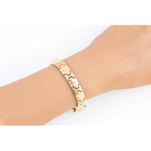 117 - AN 18CT GOLD FANCY LINK BRACELET, panel links 25 g.