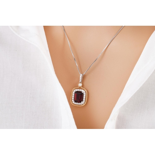 134 - A GARNET AND DIAMOND CLUSTER PENDANT, the rectangular garnet to diamond surround and bail, mounted i... 