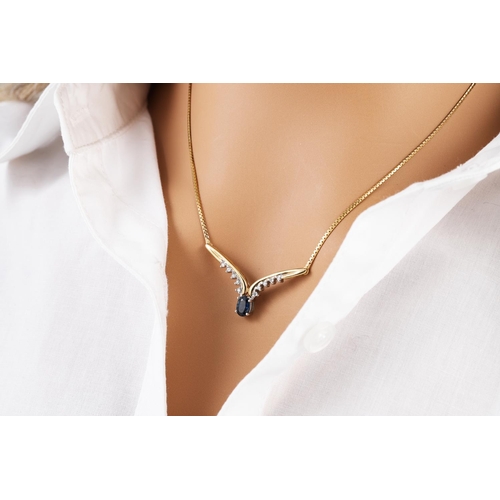 14 - A DIAMOND AND SAPPHIRE NECKLACE, mounted in gold, v-shaped to a back chain