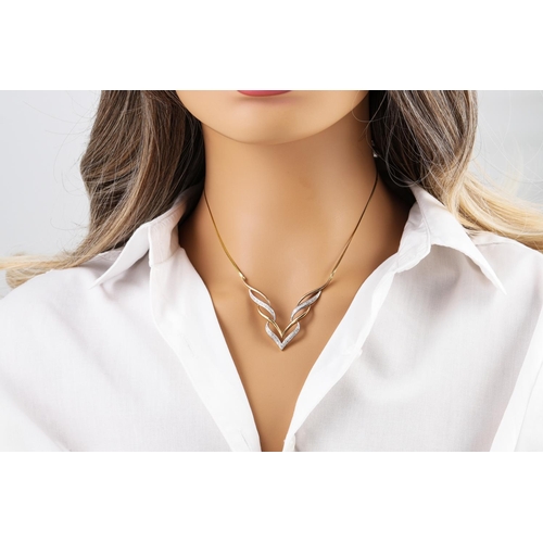 149 - A DIAMOND SET NECKLACE, v-shaped, mounted in white and yellow gold