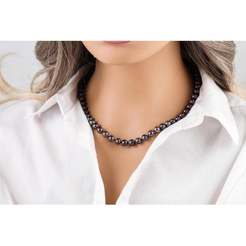 163 - A BLACK PEARL NECKLACE,  to a 14ct gold clasp