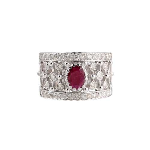 171 - A DIAMOND AND RUBY RING, the oval ruby to an open worked diamond set band, mounted in white metal.  ... 