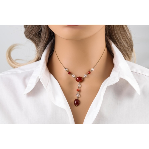 186 - AN ANTIQUE NECKLACE BY WEST AND SON, set with carnelian and crystal in a fitted case