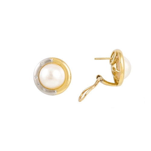 216 - A PAIR OF MOTHER OF PEARL EARRINGS, to a two tone gold and diamond surround