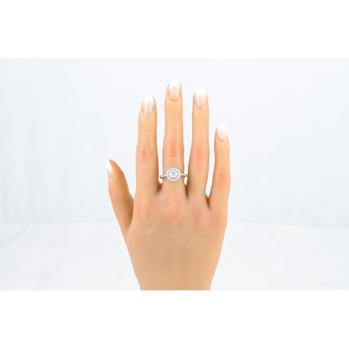 249 - A DIAMOND TARGET RING, the brilliant cut diamond to a brilliant cut diamond surround and shoulders, ... 