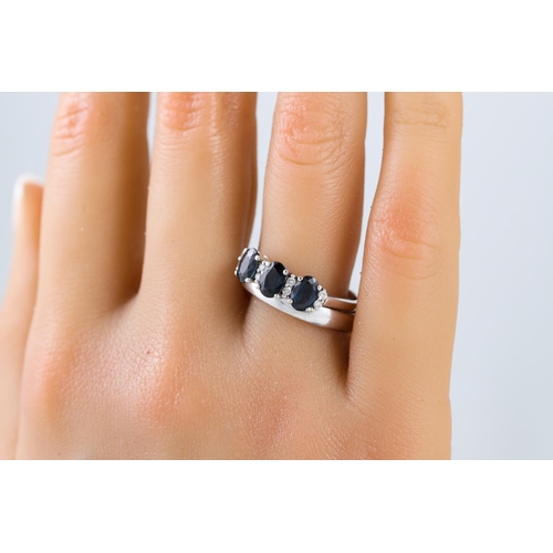 253 - A THREE STONE SAPPHIRE AND DIAMOND SET RING, mounted in 18ct white gold, size R, together with a mat... 