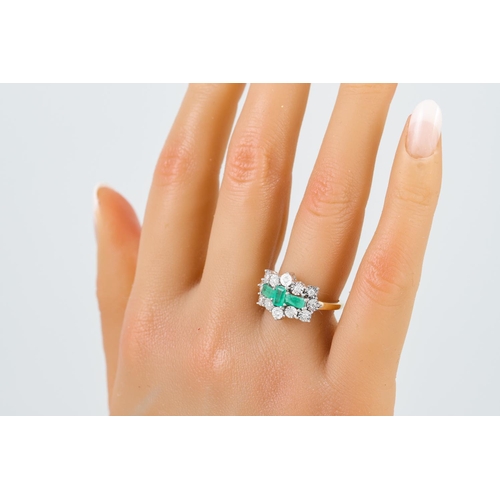 269 - A DIAMOND AND EMERALD CLUSTER RING, mounted in 9ct yellow gold. Estimated: weight of diamonds: 0.36 ... 