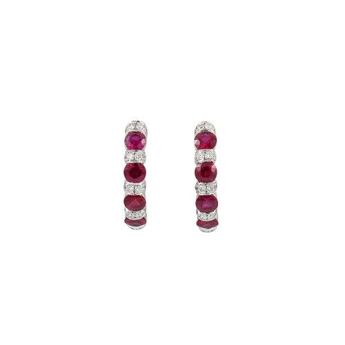 272 - A PAIR OF DIAMOND AND RUBY HOOP EARRINGS, mounted in 18ct gold. Estimated: weight of diamonds: 0.30 ... 