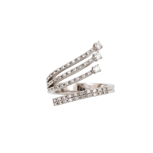 283 - A DIAMOND DRESS RING, of cross over design, the brilliant cut diamonds mounted in 18ct white gold. E... 