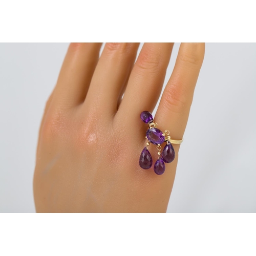 286 - AN AMETHYST DRESS RING, the oval amethyst to an 18ct yellow gold mounted, with four briolette drops ... 