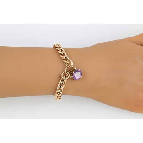 311 - A CURB LINK BRACELET, 9ct gold with amethyst set clasp