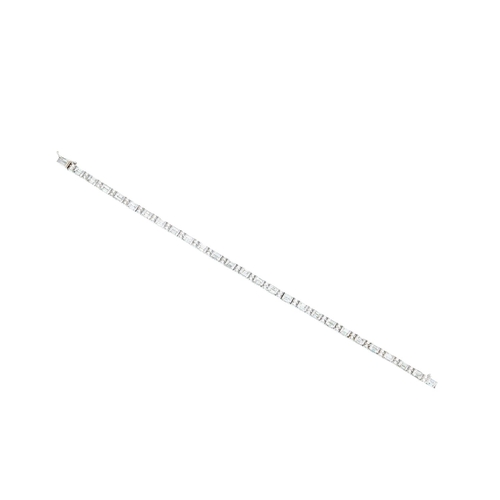 328 - A DIAMOND LINE BRACELET, set with brilliant cut diamonds and baguette cut diamonds, mounted in white... 