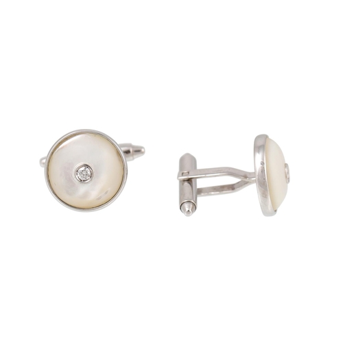 343 - A PAIR OF MOTHER OF PEARL AND DIAMOND CUFFLINKS, of circular form, mounted in 18ct white gold