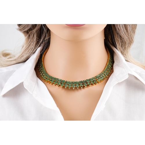 36 - AN  EMERALD FRINGE NECKLACE, of Eastern style, set with circular and pear shaped stones, (tests as 2... 