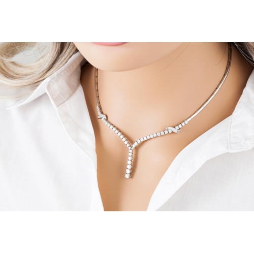 366 - A DIAMOND NECKLACE, of drop design, the brilliant and baguette cut diamonds mounted in 18ct gold. Es... 