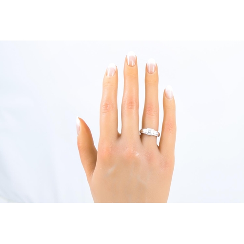 4 - A DIAMOND SET RING, the princess cut diamond mounted in white gold, size L-M