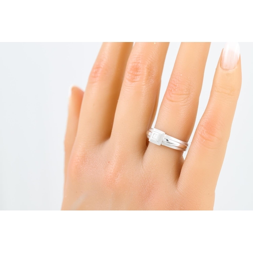 4 - A DIAMOND SET RING, the princess cut diamond mounted in white gold, size L-M