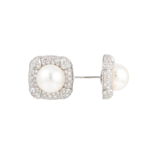 400 - A PAIR OF PEARL AND DIAMOND CLUSTER EARRINGS, the central pearls to pavé diamond surrounds, mounted ... 