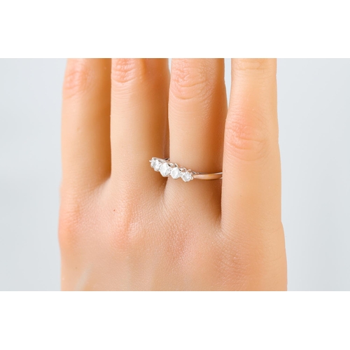 420 - A FIVE STONE DIAMOND RING, the graduated brilliant cut diamonds, mounted in 18ct white gold.  Estima... 