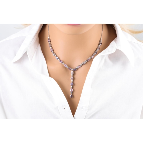 439 - A SAPPHIRE AND DIAMOND NECKLACE, of drop design, mounted in 18ct gold. Estimated: weight of diamonds... 