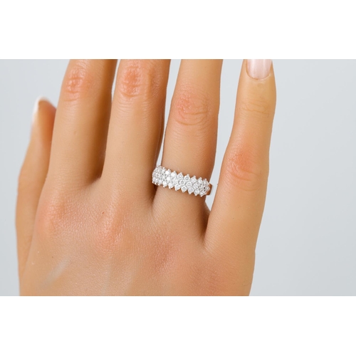 442 - A THREE ROWED DIAMOND RING, the brilliant cut diamonds mounted in 18ct white gold. Estimated: weight... 